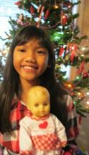 girl with doll, Christmas doll, adoption