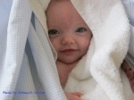 baby in blankets, baby in towels, smiling baby, baby blue eyes